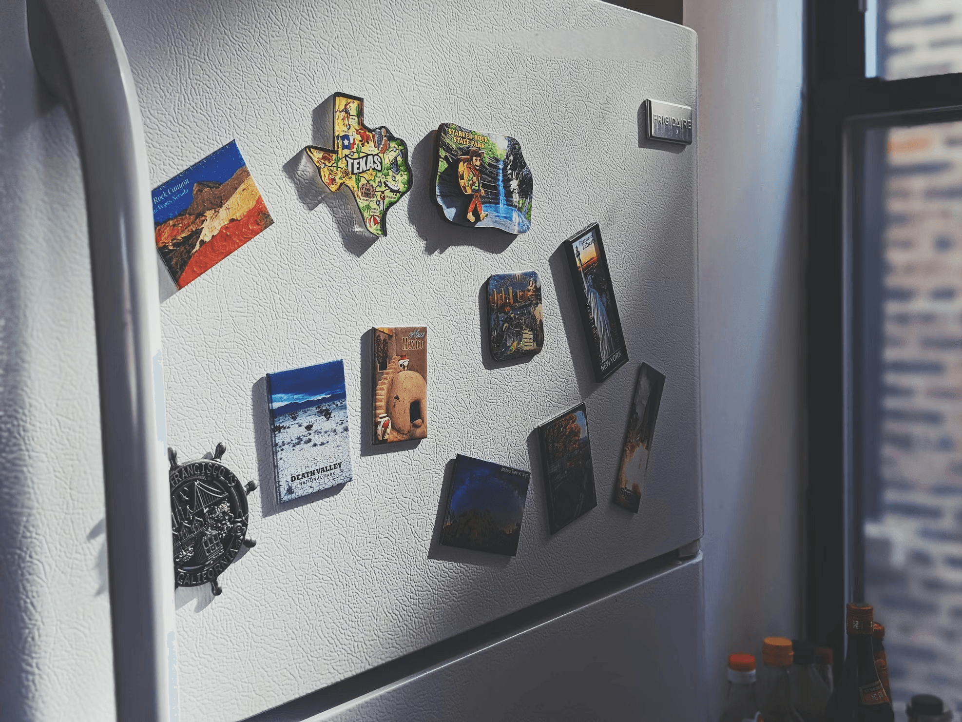 Fridge door with notes and photos