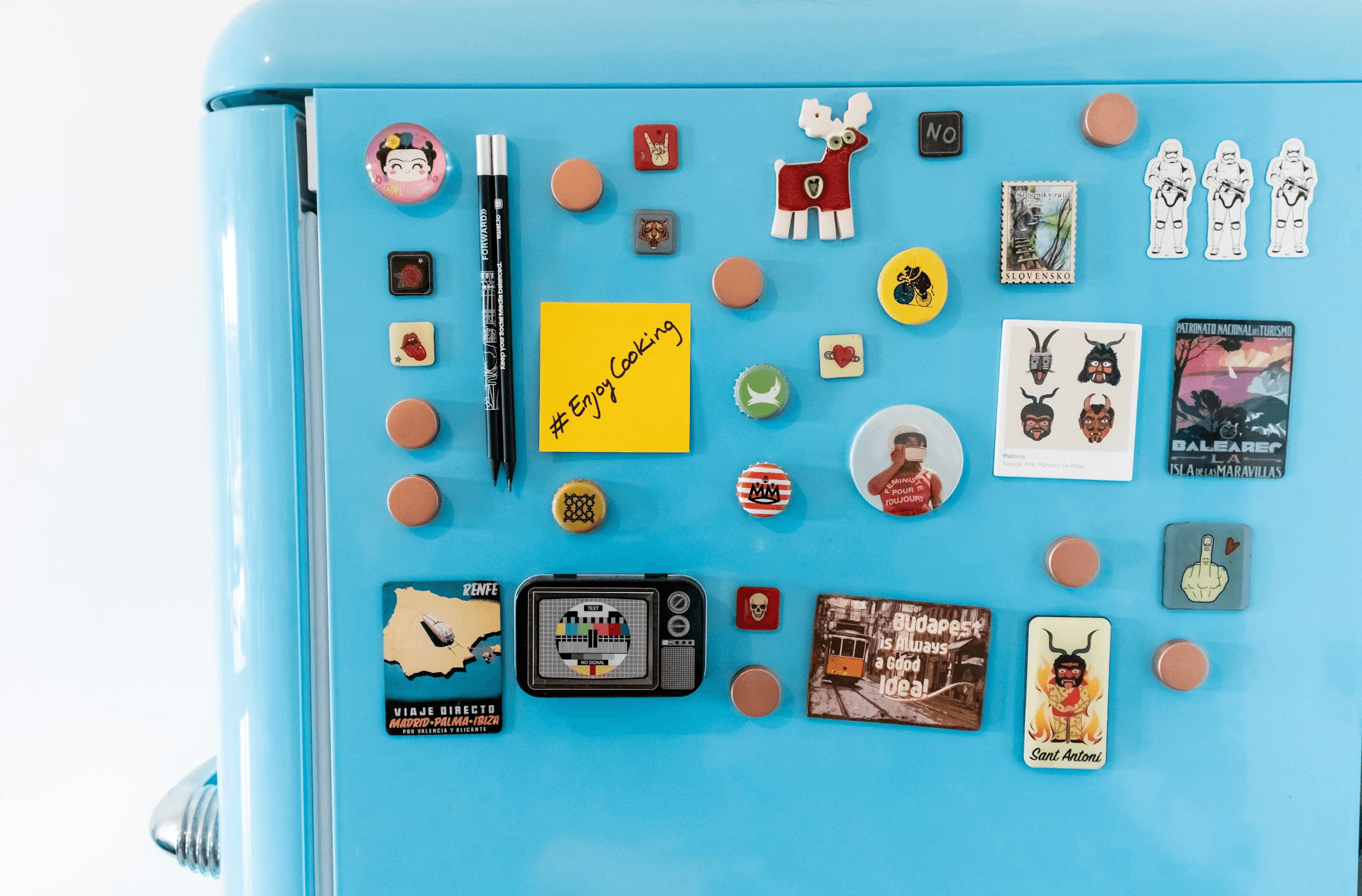 Fridge door with notes and photos